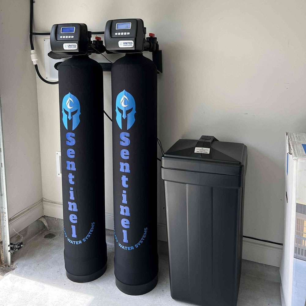 Sentinel Pro Water Softener installation in Katy, Texas front view showing twin valves.