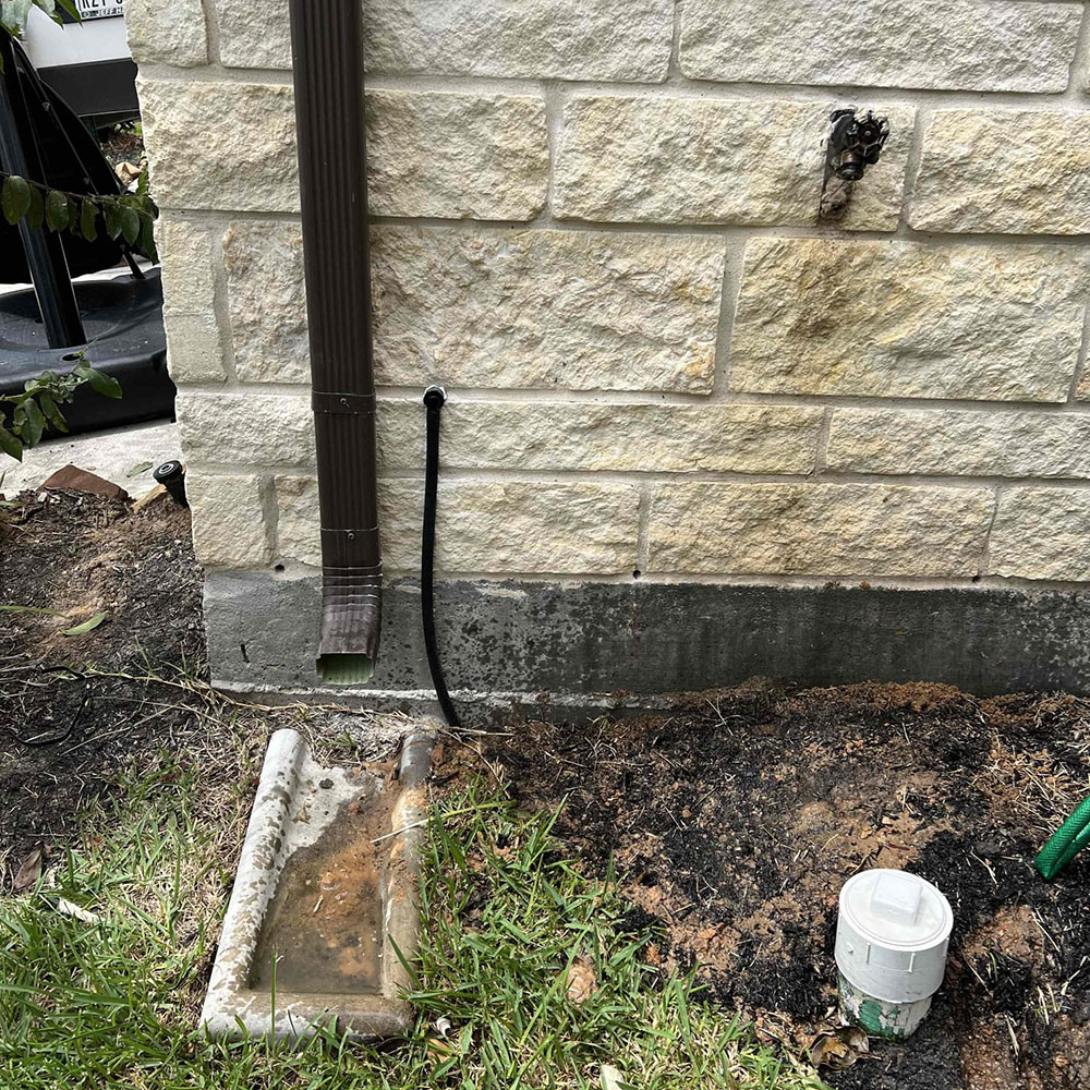 Drain line exterior expert installation.