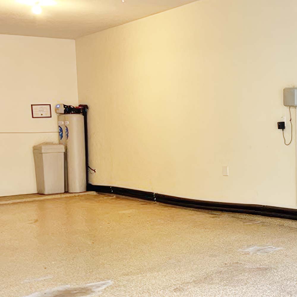 Elite Package whole-house water softener and carbon filtration system professionally installed in the back of a garage in Richmond, Texas by United Water Softeners – Houston’s #1 rated water company.