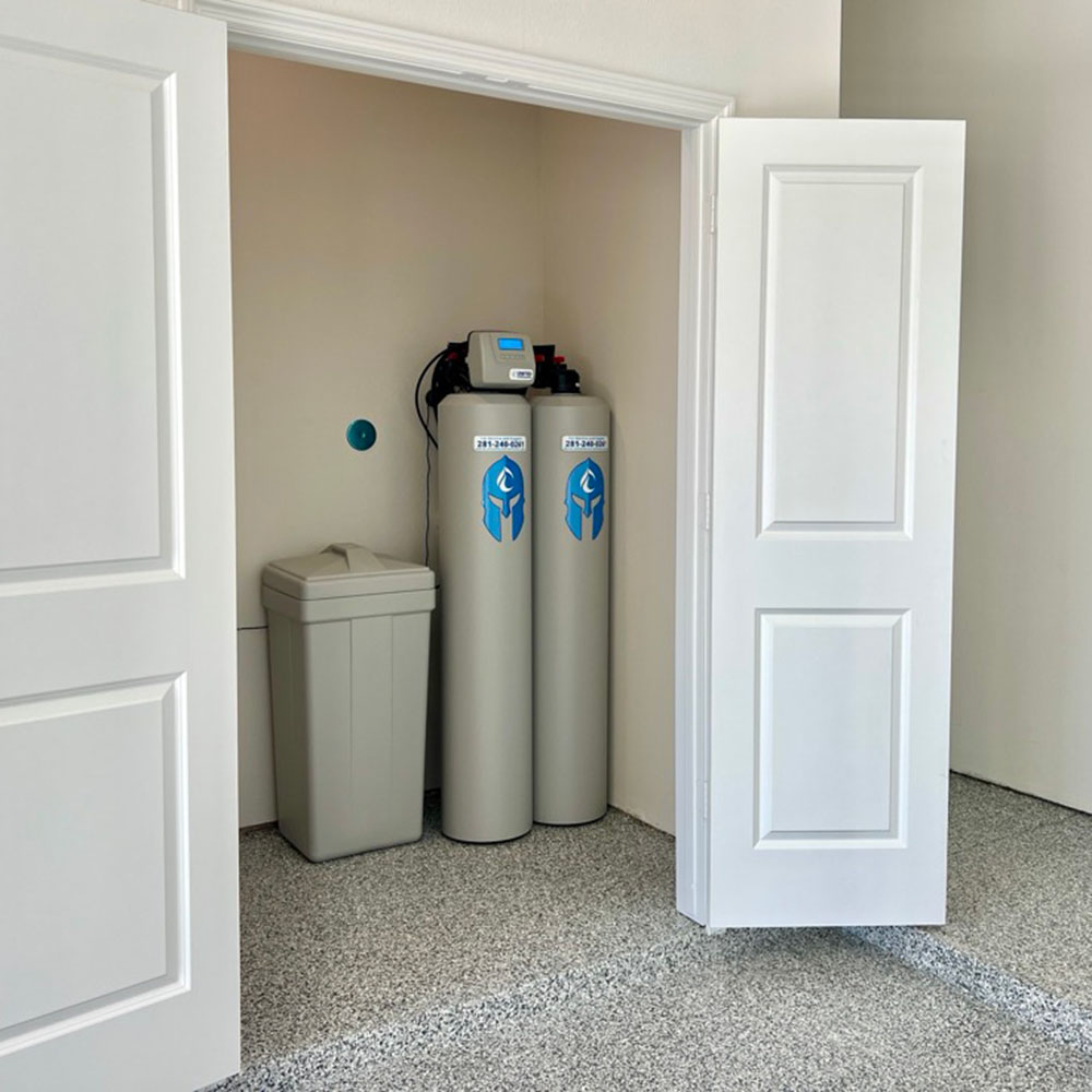 Elite Package whole-house water softener system – one of our top-selling packages – professionally installed in a secure utility closet by United Water Softeners.