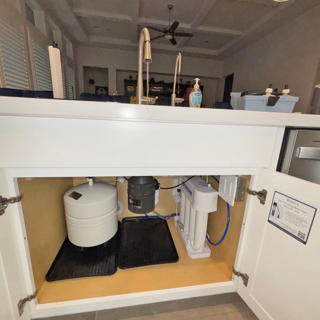 Premium reverse osmosis drinking water system professionally installed under the kitchen sink in Conroe, Texas by United Water Softeners – Houston’s number 1 rated water company.