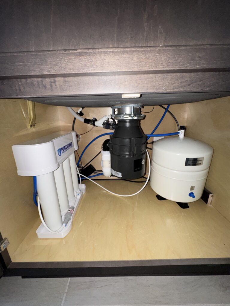 PureGuard Reverse Osmosis (RO) Drinking Water System professionally installed under kitchen sink by United Water Softeners – Houston TX