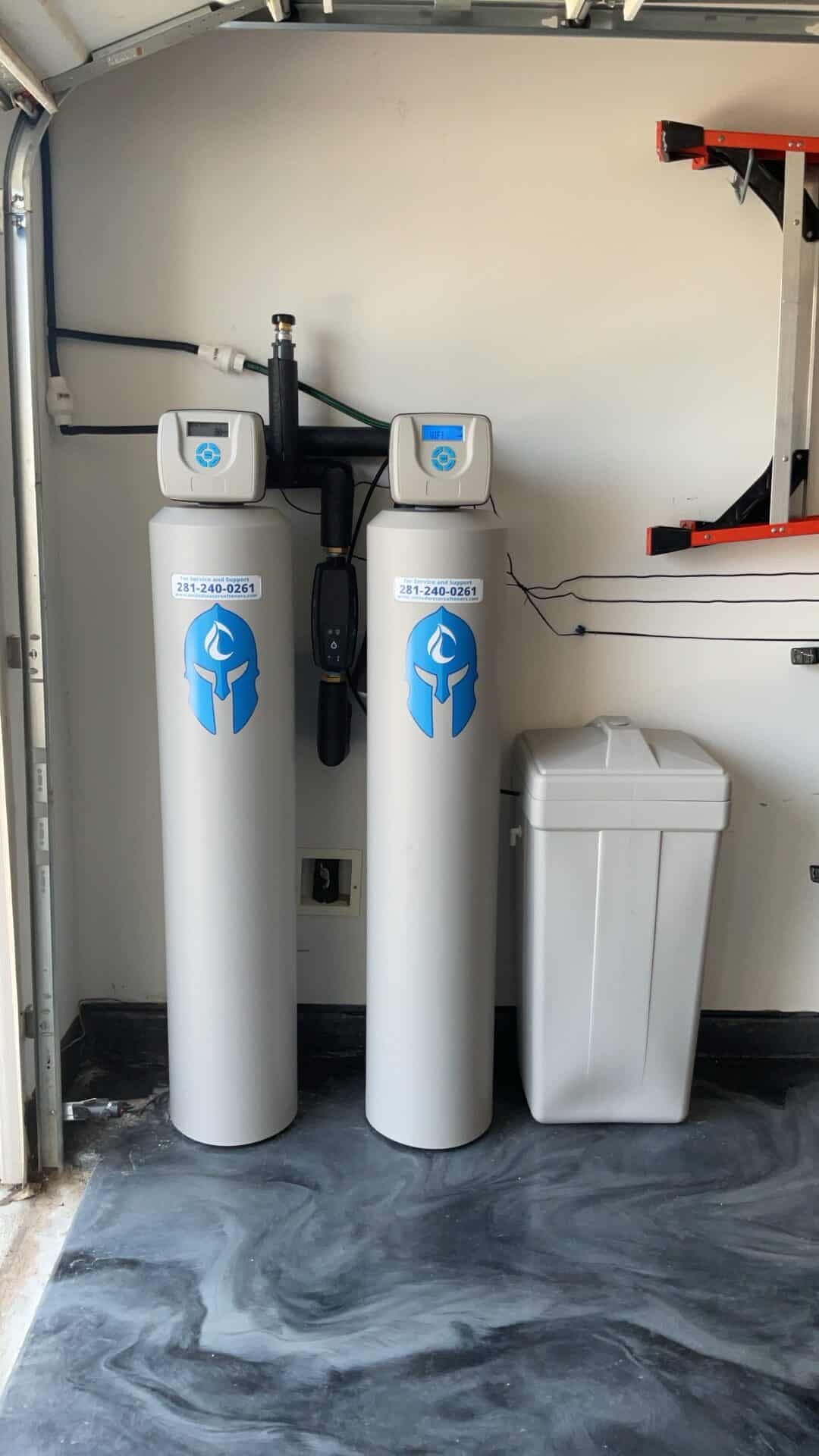 ELITE water softener and whole-home filtration system installed in a Cypress TX 77433 garage by United Water Softeners